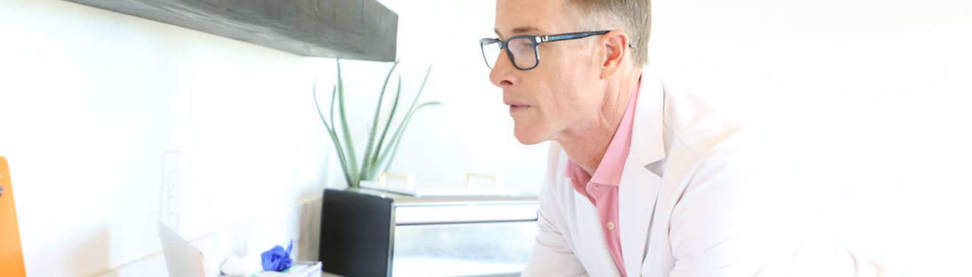 Dr. Christianson checks test results.