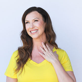 A woman in a yellow top.