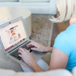 A woman with a laptop.