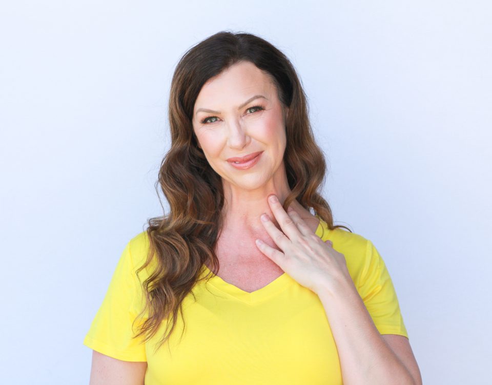 A woman in a yellow top.